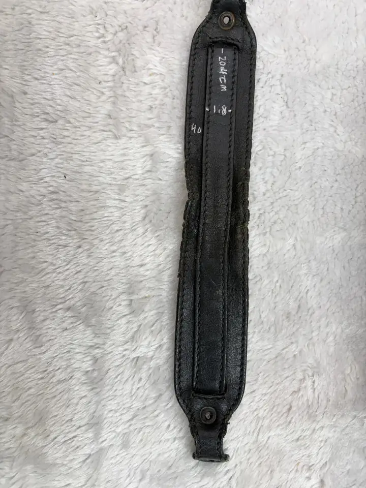 Dark color bag strap repair 4 The dimensions were drawn on to the new leather to reproduce the replacement.