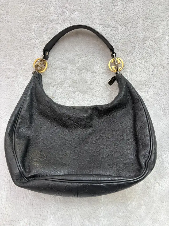 Dark color bag strap repair 5 The restored black color leather handbag with a custom made replacement leather strap.