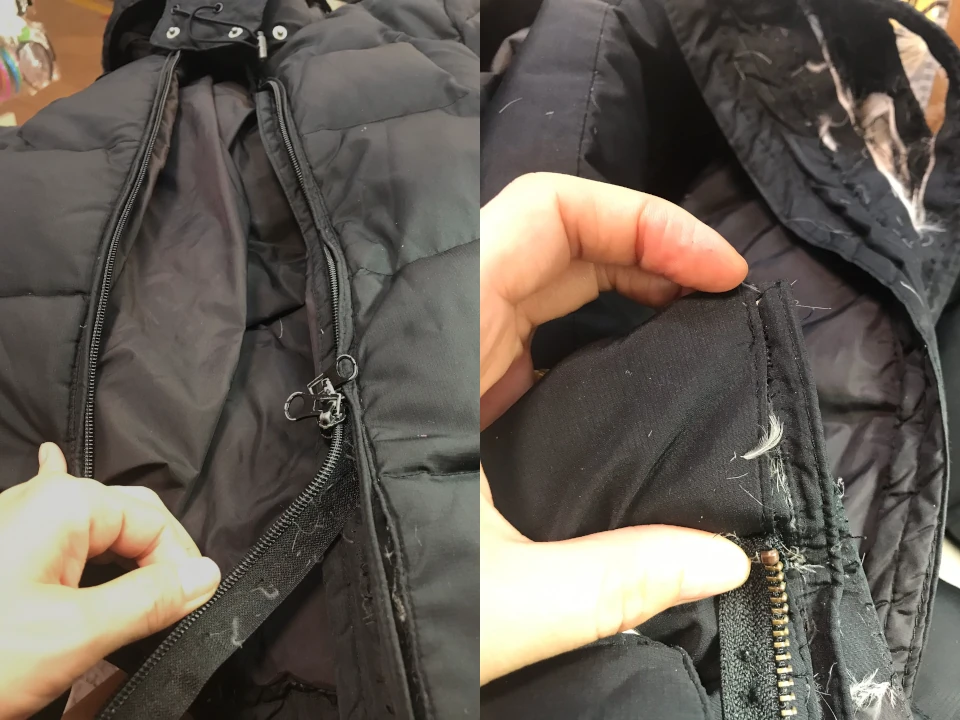 Black down winter at left half of the picture jacket zipper was broken. a zipper with 2 metal pulls was found to replace the worn zipper.