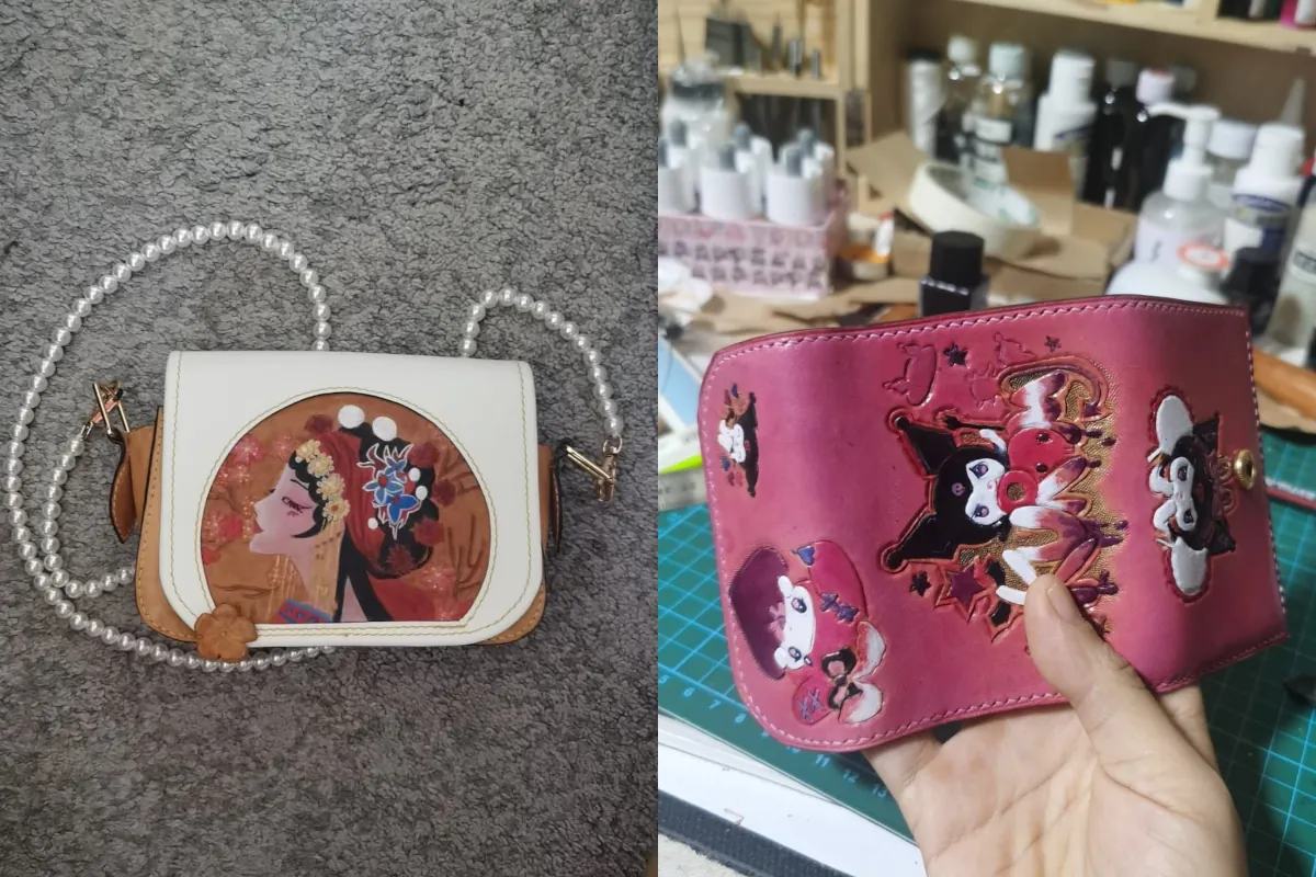 The left half of the photo shows a hand drawn picture of a female Chinese opera artiste on a purse with white pearls. The right side of the photo shows a hand holding a pink wallet with a cartoon painted on it.