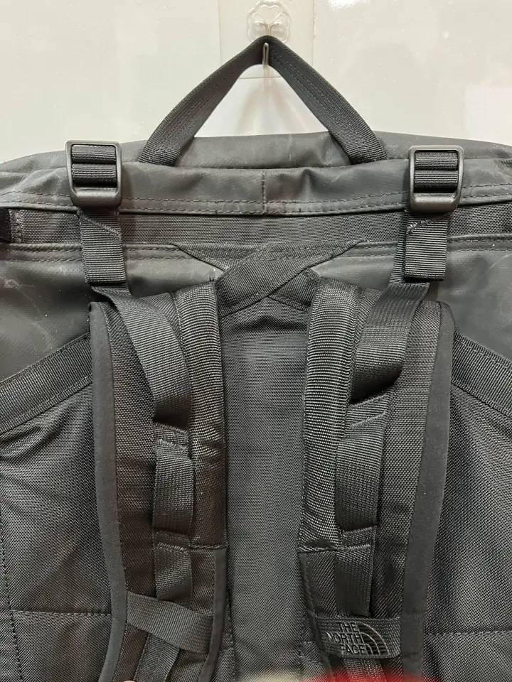 Completed repair of the black North Face backpack.