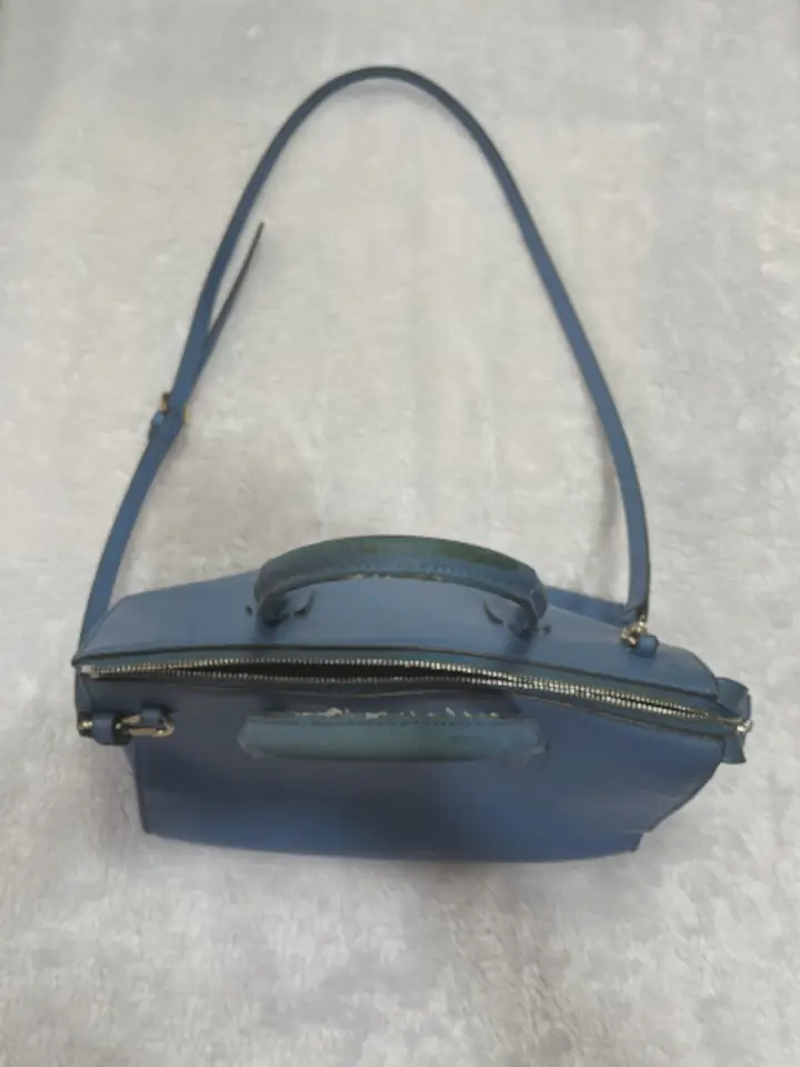 The color of the blue color Furla handbag was dull and look pale.