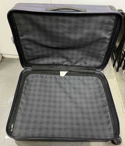 A black color luggage after its zipper compartment zipper was replaced with a new zipper.