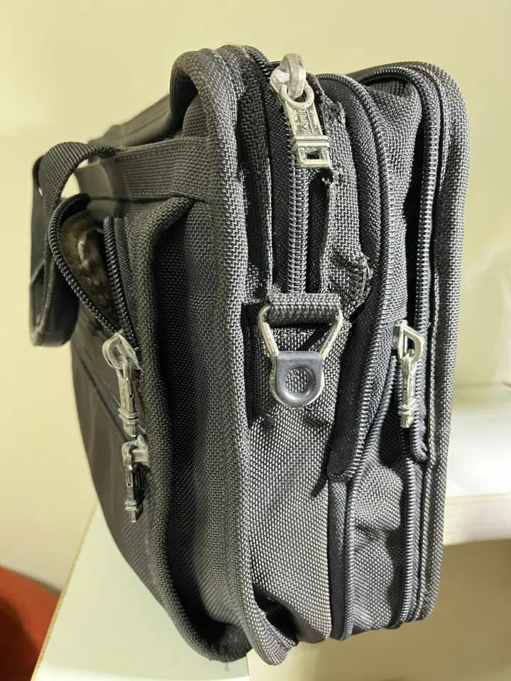 Worn out TUMI briefcase was sent over for repair a the zipper area.